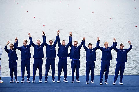 Men's eight rowing final: United States' team pose after winning Bronze